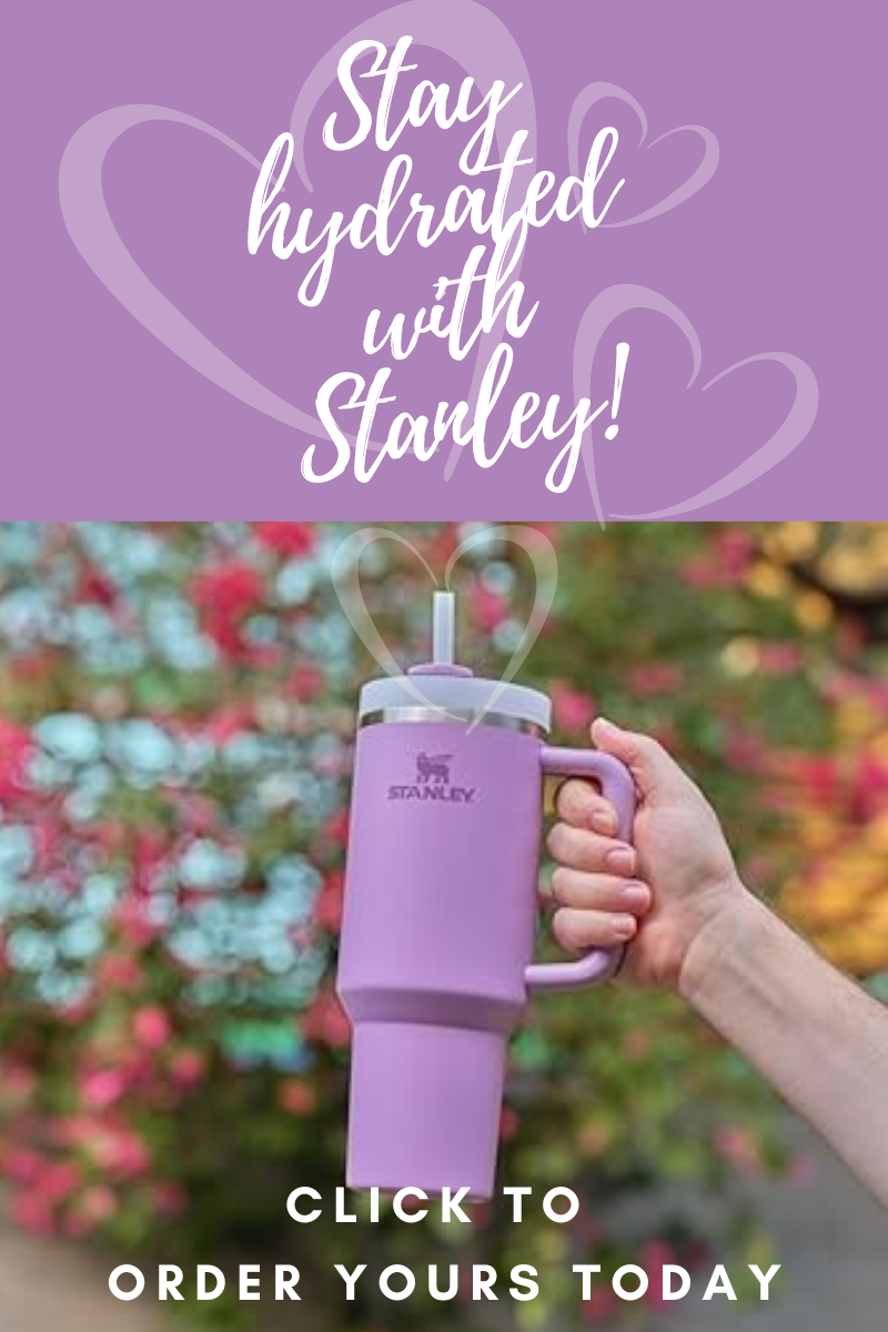 Stanley 40oz tumbler in pastel pink with a straw, designed to keep beverages hot or cold for hours.